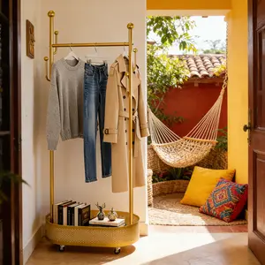Gold Finish Mobile Clothes Rack with Bottom Storage Basket Space Saving Clothing Stand for Organized Storage in Modern Design