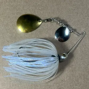 019 Custom Bingo Spinnerbait, 1/4oz Blue Satin Shad Double Colorado Nickel/Gold Blades with Brass Base, 80-Strand Tournament-Grade ProUmbrella Skirt, Hand-Crafted Premium Components in Texas, USA.