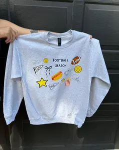 Gildan Football Season Crew Sweatshirt - Ash Color with DTF Print Design Featuring Icons and Text