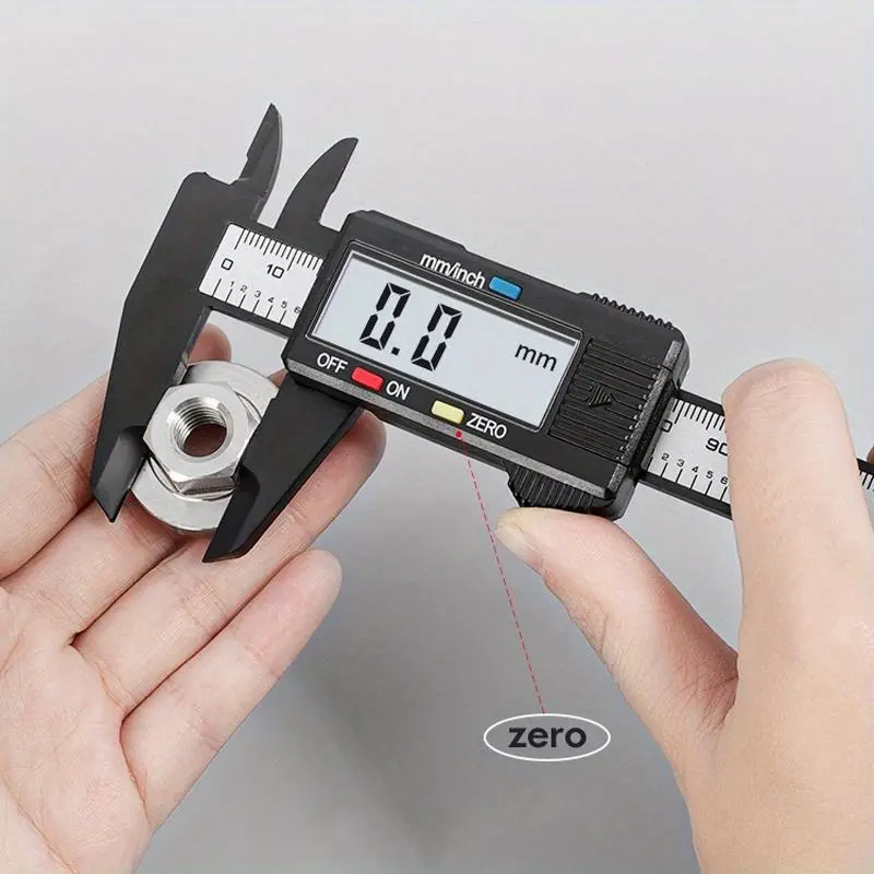 An electronic micrometer measuring tool with an LCD display, using a carbon fiber plastic vernier caliper, Digital Calipers, a battery-powered precision measuring instrument for furniture hardware parts - measuring range up to 150mm