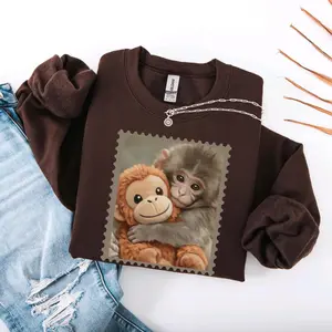 Monkey Punch Meme T-shirt – Baby Monkey Holding Plush Toy Sweatshirt – Cute Cozy Animal Lover Hoodie