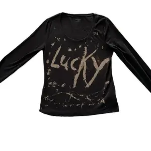 Lucky Jolt The Charm Long Sleeve Top with Graphic Design in Black Shirts Comfort Womenswear