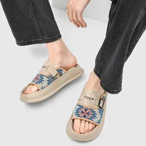 Men’s FDCP Logo Native Ethnic Print Buckle Platform Slide Sandals. Mixed upper of Navajo geometric jacquard fabric and suede-like leather, adjustable single metal buckle strap fits all foot widths.