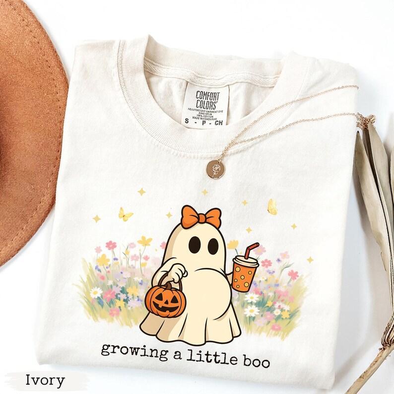 [Saleup to 75%] Comfort Colors Halloween Maternity Shirt, Growing A Little Boo, Funny Pregnancy Announcement 2025 Shirt, Spooky Pregnant Costume, New Mommy