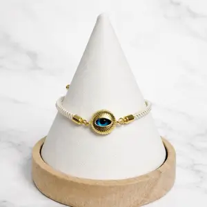 Pulsito de Ojito Totally Adjustable Bracelet with Gold Evil Eye Charm and Blue Stone Accents