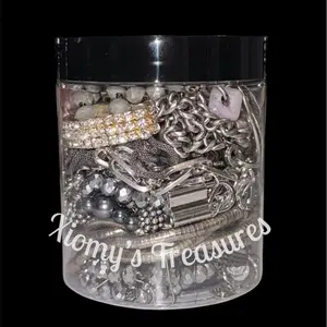 Xiomys Clear Plastic Jewelry Organizer Jar with Lid for Storage and Display Featuring Necklaces Bracelets Bangles Earrings Rings in Mixed Metal Tones