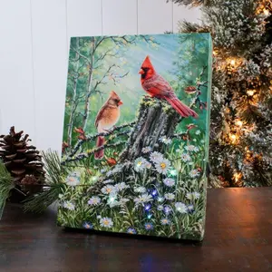 Golden Light 8x6 Lighted Tabletop Canvas by Dona Gelsinger Featuring Cardinals in a Serene Clearing with White and Purple Flowers