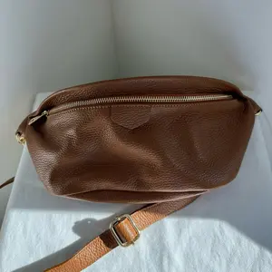 Leather Belt Bag with Zipper Closure, Adjustable Strap, and Durable Design