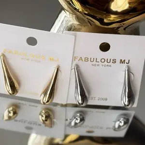 Fabulous MJ Teardrop Earrings - Silver Color, New York, Earrings with Gold Accents, Perfect for Any Occasion