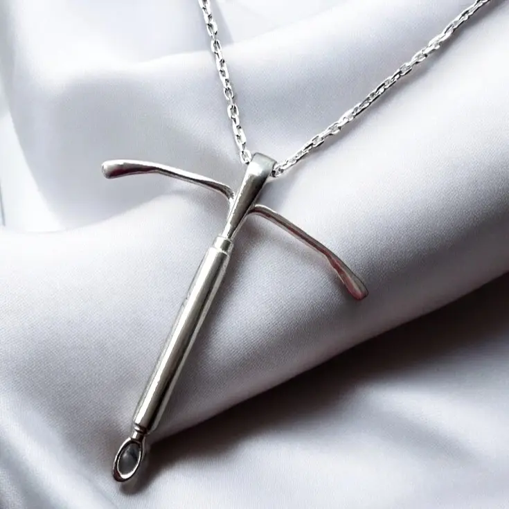 IUD Pendant by WitzJewelryDesign. Available in Sterling Silver, this 1" necklace is a bold statement piece. Personalize it to match your style with adjustable chain lengths.  This is a