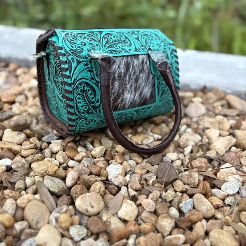 Small turquoise and cowhide tooled leather speedy purses with removable cross body strap