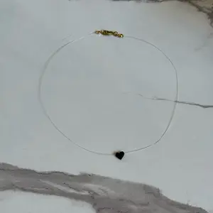 invisible cord with small azabache  heart for woman