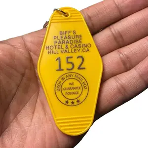 Biff's Pleasure Paradise Back To The Future Keychain - Yellow Design with "152" Number - Drop-guaranteed Postage Stamp