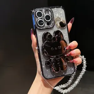Sparkling Kt Rabbit Mirror Stand Phone Case with Beaded Bracelet, Anti-Drop Protection for iPhone 17 Pro Max 16 Pro Max 15 14 13 12 11