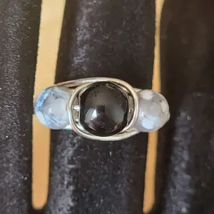 fire agate 3 Stone Wire Wrapped Ring with Black Center Stone and Blue and White Accents