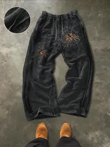 Men's washed and distressed straight-leg trousers, featuring a distressed finish and a spider print. These casual trousers are suitable for all seasons and are ideal for holiday relaxation.
