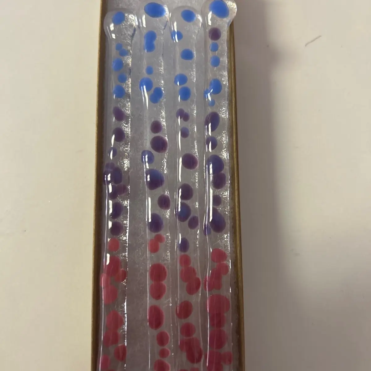 Infused glass cocktail stirrers