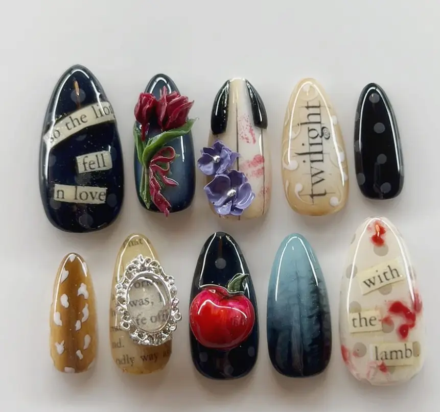 Twilight-inspired nail art featuring iconic quotes, 3D roses, an apple, and dark mystical vibes with blood-red details for a dramatic gothic look