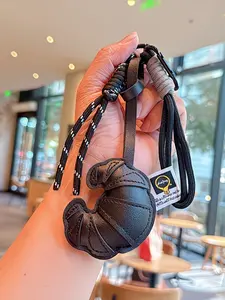 PU Leather Croissant Bag Charm Keychain with Braided Strap, Cute Coffee Shop Aesthetic Pastry Pendant, Handmade Bread Shaped Key Ring for Tote/Backpack/Purse, Minimalist Neutral Accessory Gift for Women & Teens
