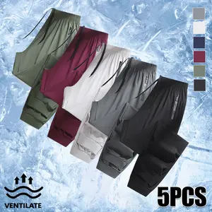 Men’s summer athletic jogger pants made from high-elastic fibers; solid-color casual joggers with letter print and zippered pockets; elastic drawstring waist; regular fit; breathable, comfortable running training pants.