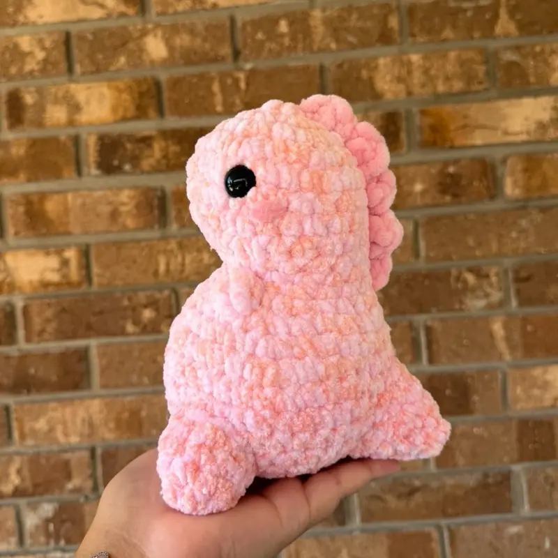Handmade crochet coral dino plushie