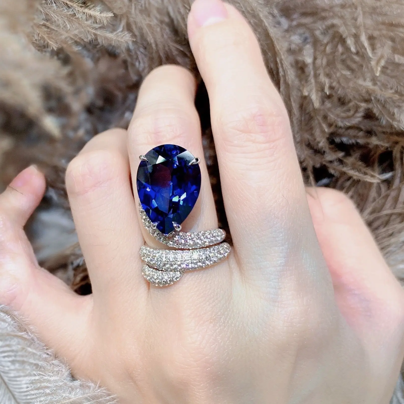 blue.A luxurious hand polished Moissanite ring paired with blue zircon. Exquisite craftsmanship.blue Sparkling Moissanite and zircon. Master level aesthetic design. Excellent quality. Brilliant and radiant. High quality hand polished. Unmatched talent.