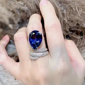 blue.A luxurious hand polished Moissanite ring paired with blue zircon. Exquisite craftsmanship.blue Sparkling Moissanite and zircon. Master level aesthetic design. Excellent quality. Brilliant and radiant. High quality hand polished. Unmatched talent.