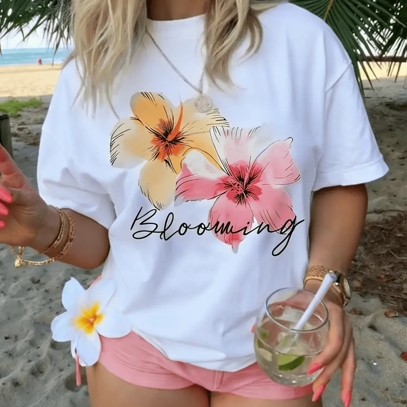 Women's Loose-fitting White T-shirt- Stylish Design, Adorned with a Yellow-orange and Pink Double Floral Pattern and the Elegant Floral Lettering "Blooming"| Suitable for Beach Leisure or Outdoor Relaxation, Easily Matched with Various Summer Look