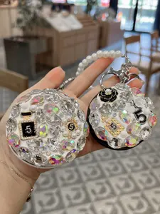 Creative Korean-style round mirror keychain with glass crystal, convenient folding mirror key chain bag charm for women