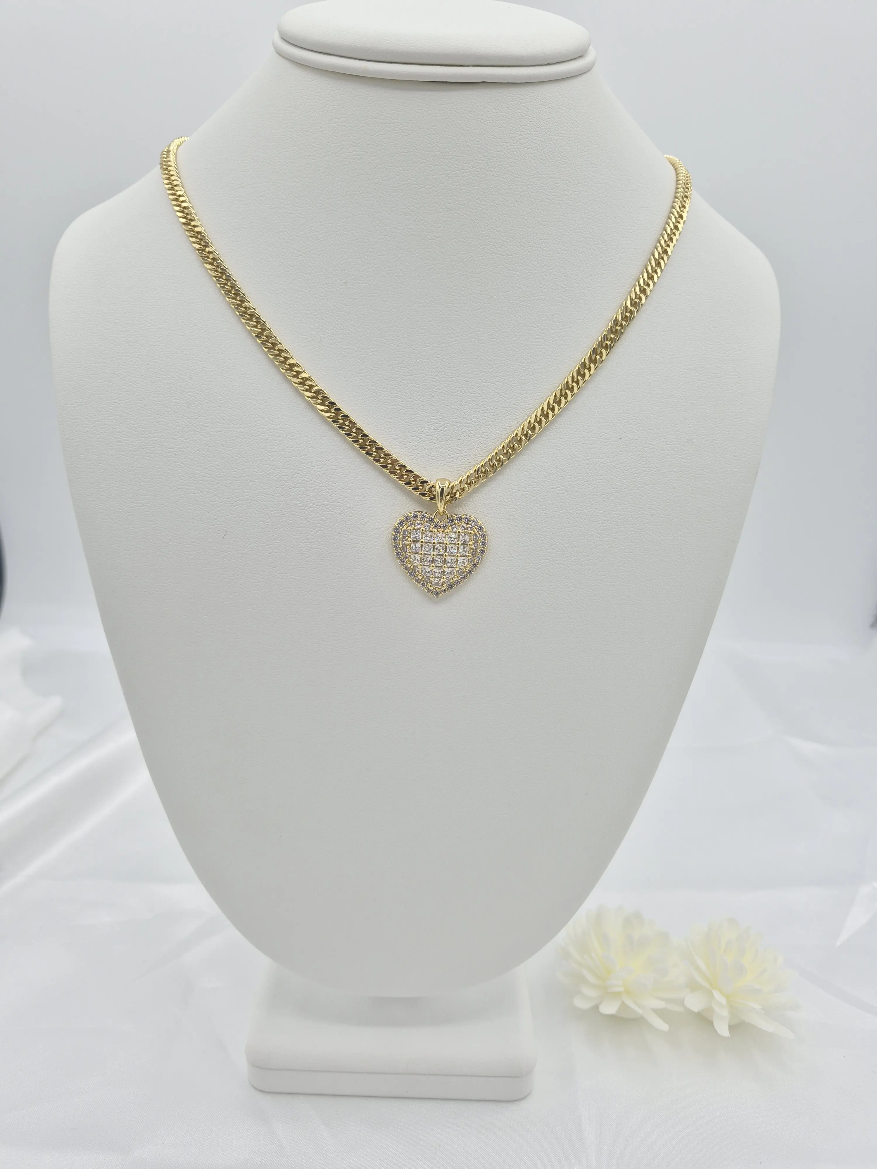 14k gold plated chain with heart pendant and cubic zirconia stones.(32)