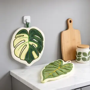 A set of two adorable hand towels featuring cartoon designs—incorporating elements such as starfish, seashells, and leaves—that serve as perfect hanging home decor.