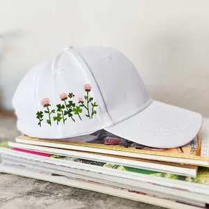 Embroidery baseball cap materials set including a hat, pattern, and floss