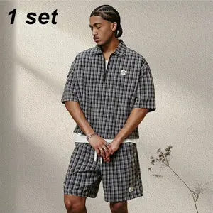 American retro black-and-white plaid half-zip polo set for men—summer loose, breathable short-sleeve top and shorts two-piece. Relaxed high-street style with a cool feel; minimalist, premium look suitable for everyday commuting and home leisure.