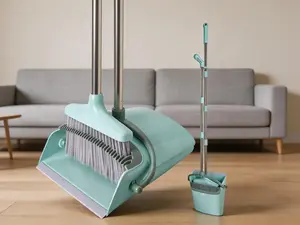 Broom and dustpan set with self-cleaning teeth. Equipped with a long handle for comfortable indoor sweeping at home, in offices and kitchens, in a fresh blue-green tone.
