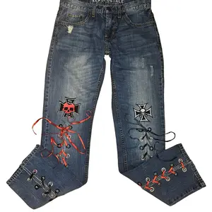 Upcycled Skull and Crosses Lace-Up Jeans - Womenswear Denim - Unique Sustainable Fashion with Red and White Skull Patch & Cross Applique