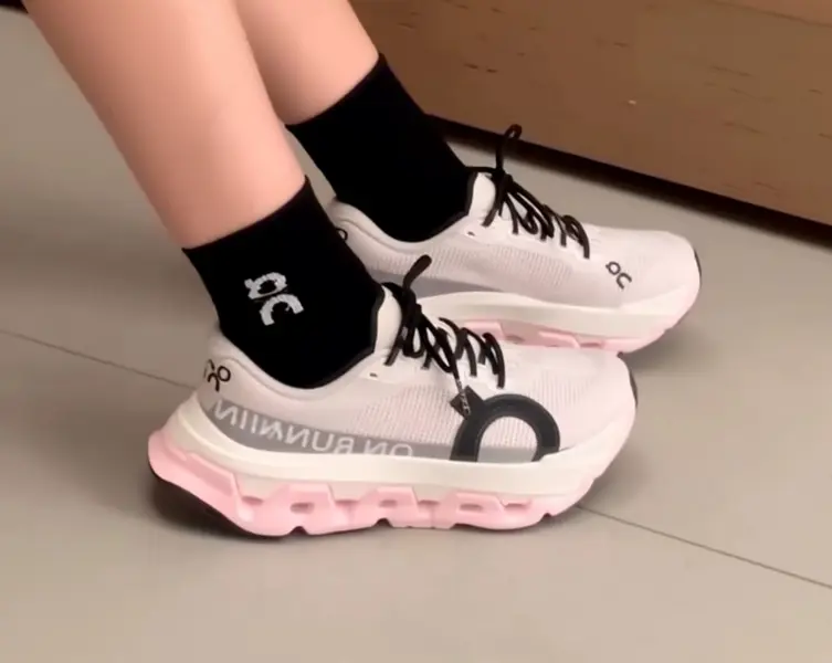 Running sneakers with game-changing hollow segmented shock cushioning, woven breathable mesh in soft off-white with pastel pink midsole accents, grippy rubber outsole, a must-have functional pick for daily jogging & casual urban commutes