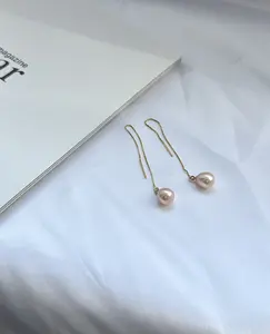 E25-The ‘Apricot Glow’ Linear Pearl Threaders — A Minimalist Drop in Sun-Kissed Hues. pearl threader earrings, pearl drop earrings, long pearl earrings, peach pearl earrings, orange pearl earrings, freshwater pearls, quiet luxury