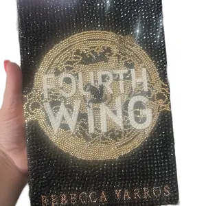 Rebecca Varros Fourth Wing Bedazzled Book with Sparkling Gold Design and Black Background