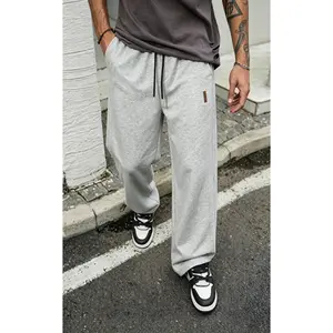 Men’s 65% cotton sweatpants, two ways to wear: straight leg or jogger fit, side leather tag, drawstring elastic waistband, soft street-style athletic pants suitable for everyday wear, walking, and casual outfits.