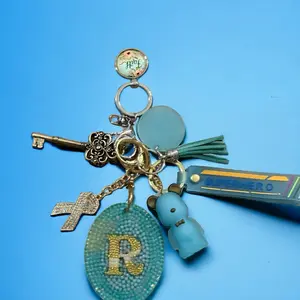 Royal Beads Trinkets & Decor, Oval R keychain teal and a touch of yellow