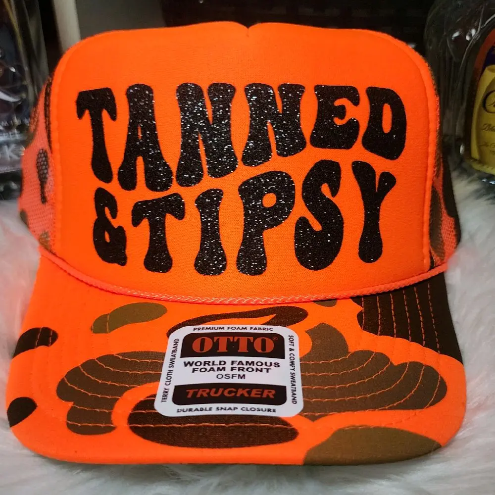 TANNED & TIPSY Trucker Hat - Fashion Accessory with Bold Text Design and Unique Patterns