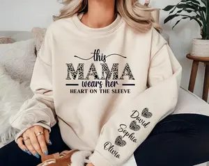 Custom This Mama Wears Her Heart On Her Sleeve Sweatshirt, Personalized Mom With Kids Names Apparel, Motherhood Gifts, Mother's Day Gift