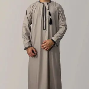 New solid color round neck embroidered thick tassel Oman dress Saudi Arabian men's long sleeved robe transparent fabric Muslim dignified formal attire