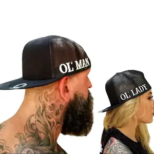 THE OUTLAW DUO SIDE STYLE BLACK HAT – Black Snapback Hat, Mesh Back Trucker Style With Flat Bill, Everyday Streetwear Accessory, Bold White Side Print For Confident Modern Outfits