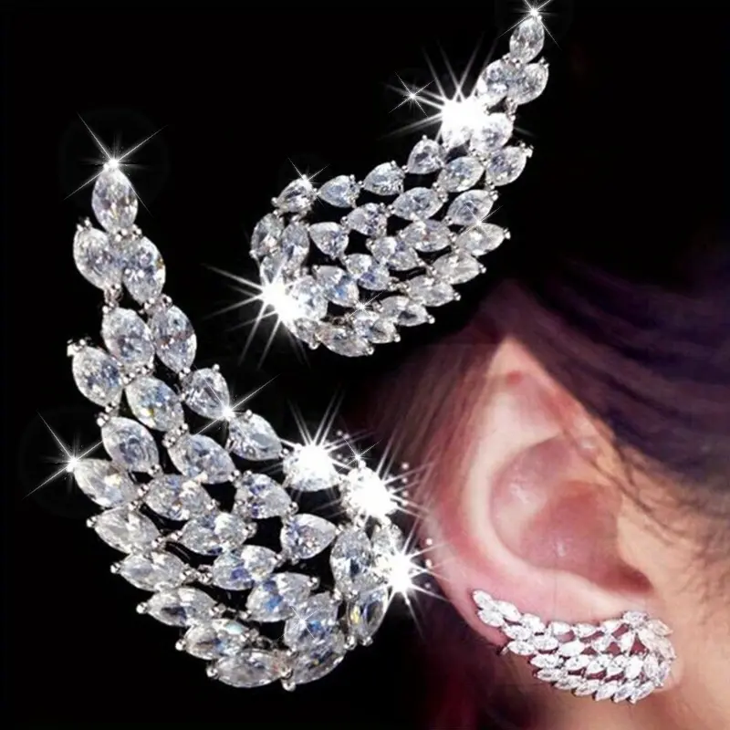 A pair of stylish and delicate angel wing earrings - luxurious copper earrings inset with sparkling synthetic cubic Zirconia, perfect for party weddings, everyday party accessories for women, birthday anniversary gifts