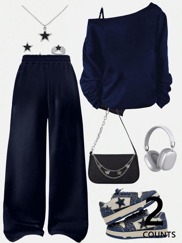 A teenage girl's off-shoulder top and wide-leg casual trousers; a loose-fitting, oversized casual long-sleeved top with a letter print paired with loose-fitting drawstring trousers; soft, suitable for women, and versatile.