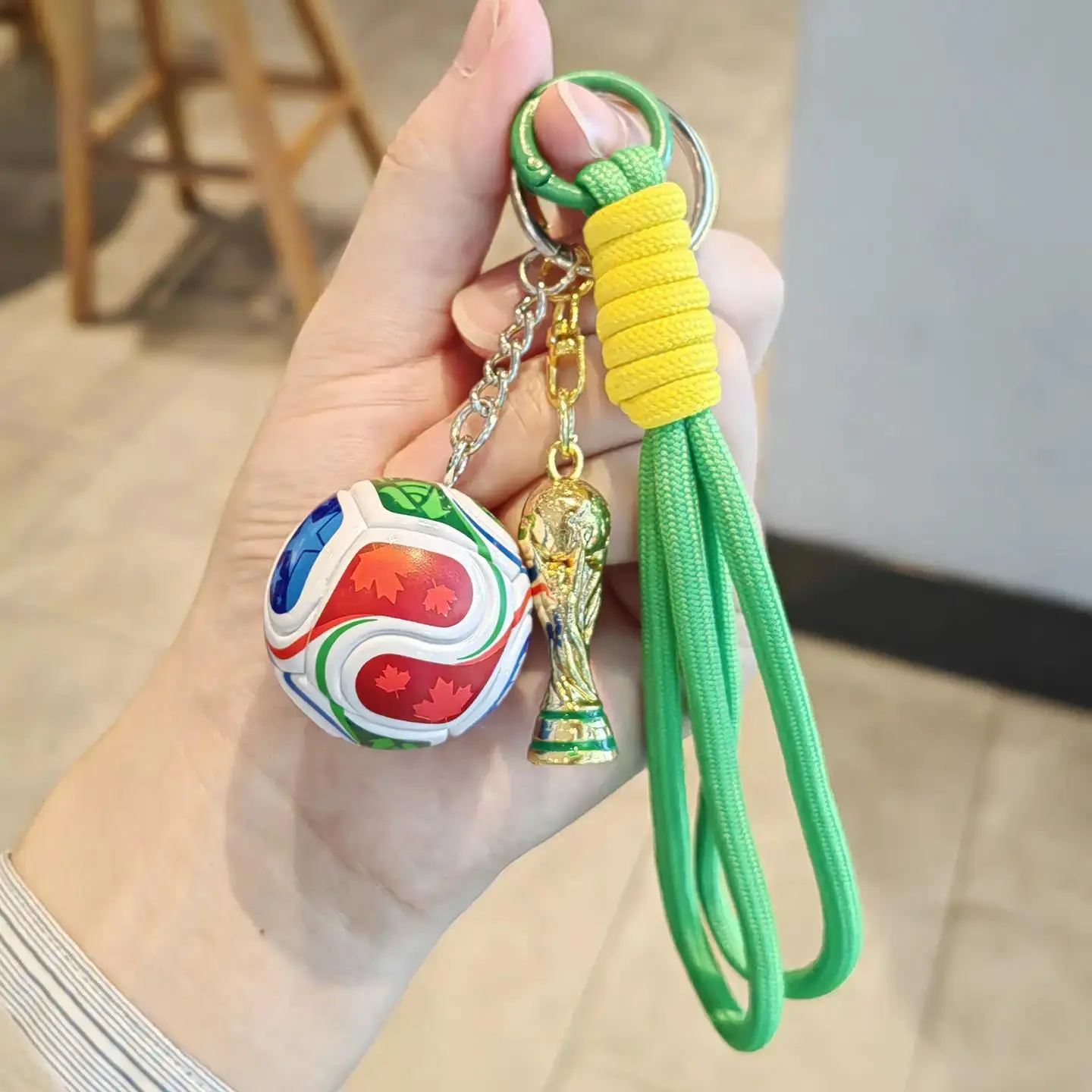 World Cup football + Golden Cup + Dark green rope