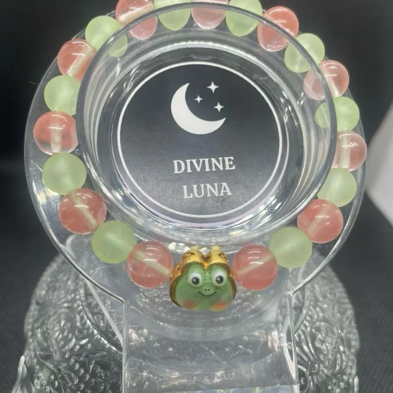 Froggie Charm Bracelet - Light Green Beads with Blush Colored Beads, Decorative Design, Unique Charm with Frog Character comes in mesh bag and freebie with purchase