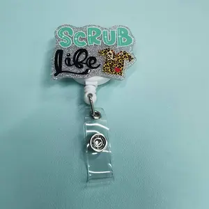 Medical (surgical gown) themed badge, Badge Buddy Nursing, retractable buckle, body is silver glitter design, with "Scrub Life" text, leopard print surgical gown pattern, equipped with retractable structure and clip, Badge Reels Retractable