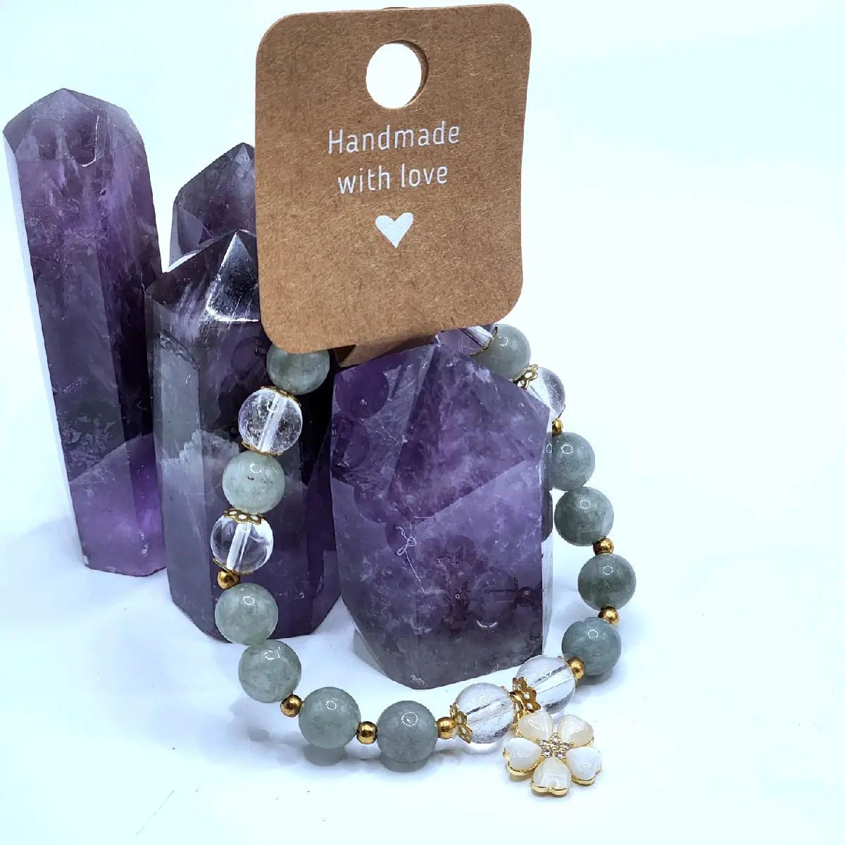 Green Jade & High Quality Clear Quartz Crystal Bracelet with Cream Mica Flower Charm in Gold along with Gold Accents